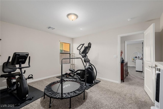 workout room featuring visible vents, carpet, and baseboards