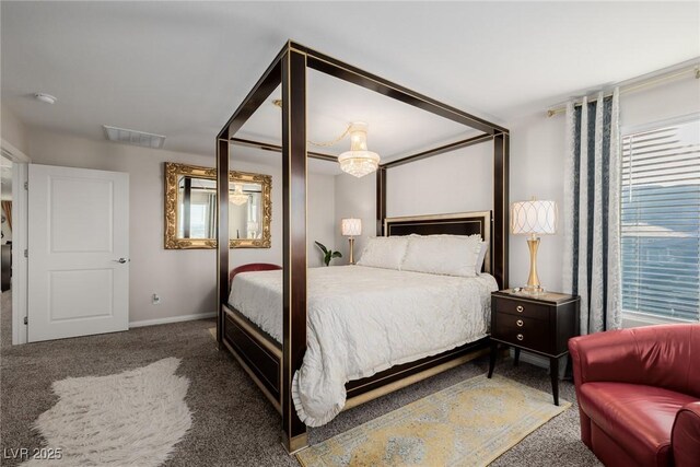 carpeted bedroom featuring visible vents and baseboards