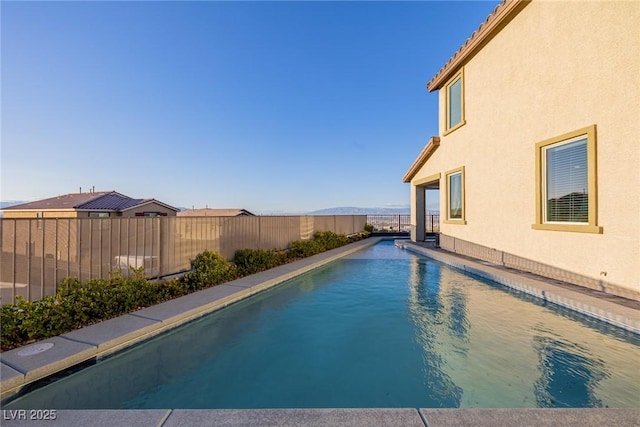 view of pool featuring a fenced in pool and a fenced backyard