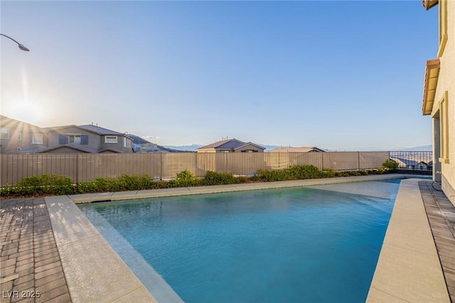 view of swimming pool featuring a fenced in pool and a fenced backyard