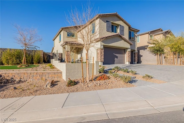 view of front of property featuring fence, driveway, stucco siding, a garage, and a tile roof