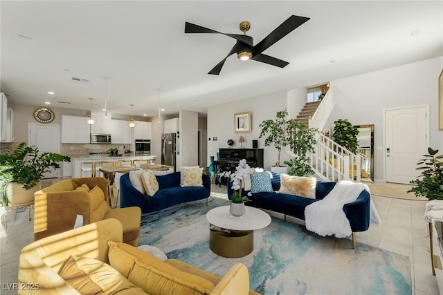 living area featuring visible vents, stairway, recessed lighting, light tile patterned flooring, and a ceiling fan