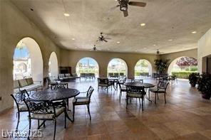 3609 Citrus Heights Ave, North Las Vegas, NV 89081 - dining room featuring healthy amount of natural light, a ceiling fan, arched walkways, and recessed lighting