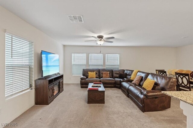 2945 Torreon Ln, Las Vegas, NV 89121 - living area with visible vents, light carpet, and ceiling fan