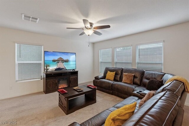 2945 Torreon Ln, Las Vegas, NV 89121 - living area featuring light carpet, visible vents, and ceiling fan