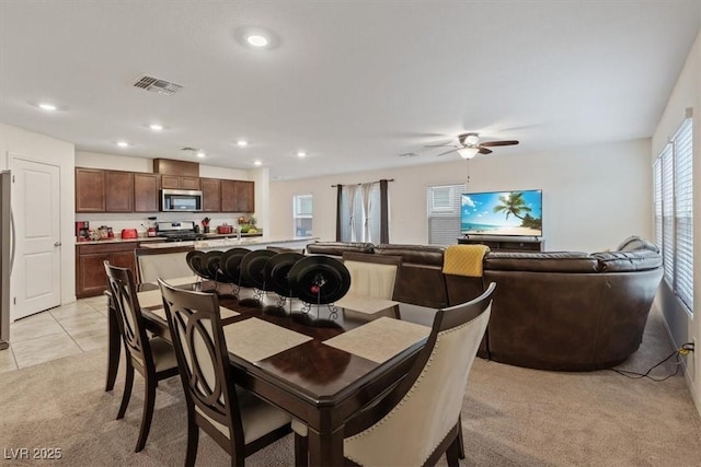2945 Torreon Ln, Las Vegas, NV 89121 - dining room featuring visible vents, ceiling fan, light carpet, light tile patterned floors, and recessed lighting