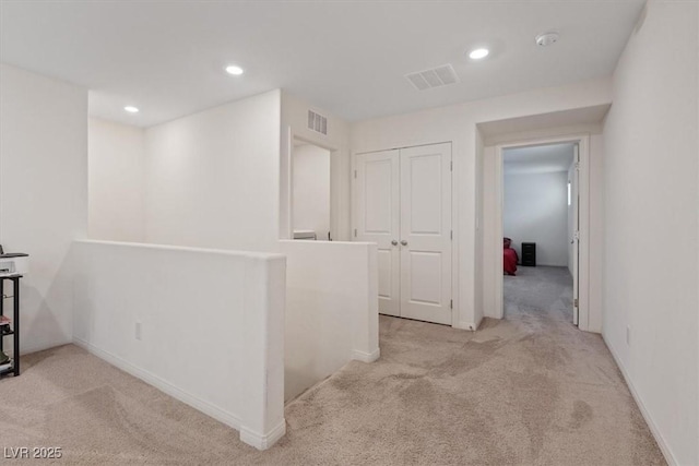 2945 Torreon Ln, Las Vegas, NV 89121 - corridor with carpet flooring, an upstairs landing, and visible vents