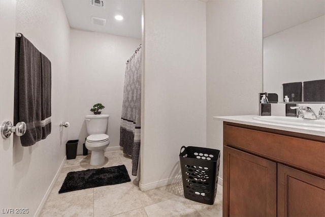 2945 Torreon Ln, Las Vegas, NV 89121 - bathroom with vanity, toilet, baseboards, and visible vents