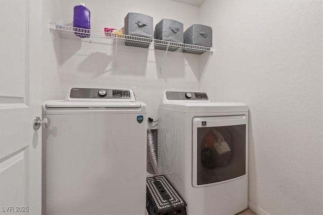 2945 Torreon Ln, Las Vegas, NV 89121 - washroom featuring washing machine and clothes dryer, laundry area, and baseboards