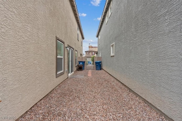 2945 Torreon Ln, Las Vegas, NV 89121 - view of property exterior featuring stucco siding and fence