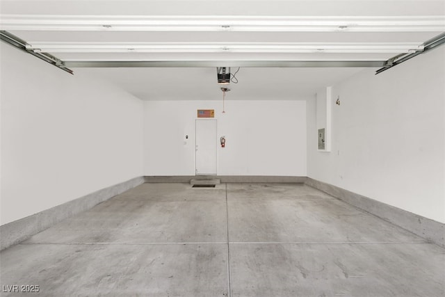 965 Nevada State Dr Unit 36102, Henderson, NV 89002 - garage with electric panel, a garage door opener, and baseboards