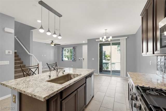 965 Nevada State Dr Unit 36102, Henderson, NV 89002 - kitchen featuring a sink, dark brown cabinetry, appliances with stainless steel finishes, and pendant lighting