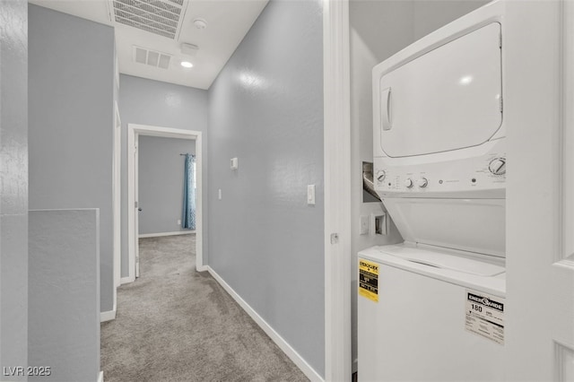 965 Nevada State Dr Unit 36102, Henderson, NV 89002 - laundry area with carpet, stacked washing maching and dryer, baseboards, visible vents, and laundry area