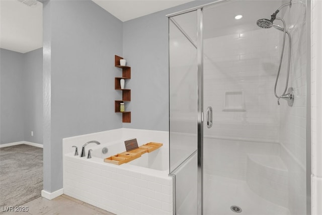 965 Nevada State Dr Unit 36102, Henderson, NV 89002 - full bathroom featuring tile patterned flooring, a stall shower, baseboards, and a bath