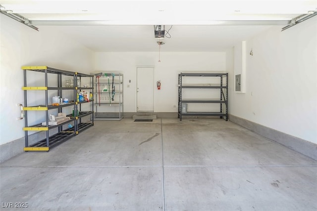 965 Nevada State Dr Unit 36102, Henderson, NV 89002 - garage with baseboards, a garage door opener, and electric panel