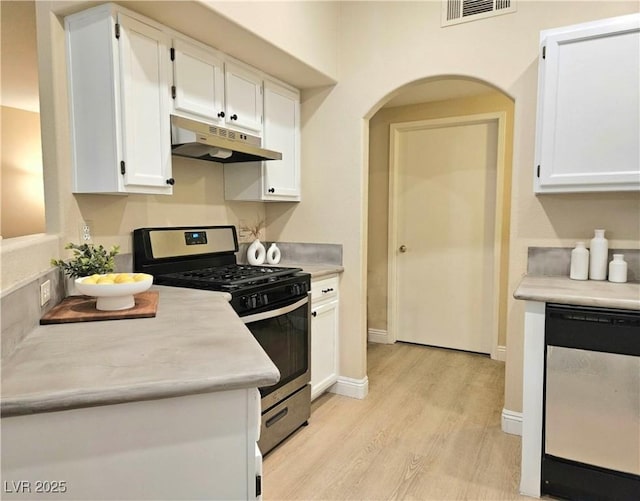 9000 S Las Vegas Blvd Unit 1187, Las Vegas, NV 89123 - kitchen with under cabinet range hood, stainless steel gas range oven, dishwasher, light wood-style flooring, and white cabinets
