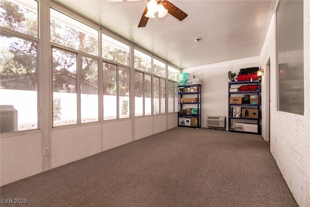 unfurnished sunroom with a healthy amount of sunlight and a wall mounted air conditioner