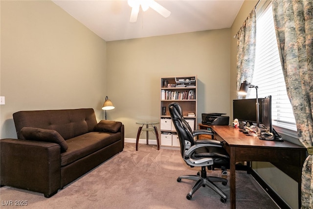 carpeted office featuring ceiling fan and baseboards