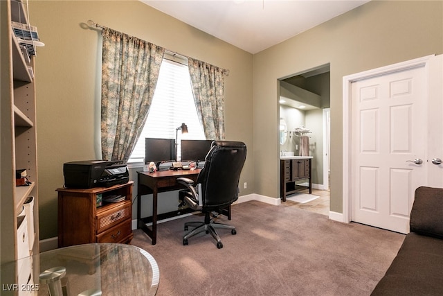 office with baseboards and carpet