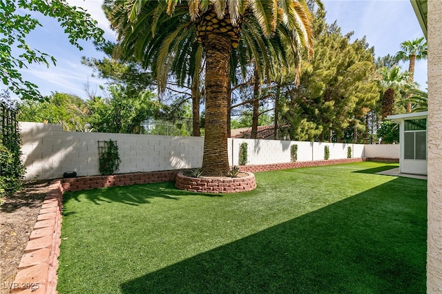 view of yard with a fenced backyard