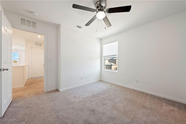 3981 E Teller Dr, Pahrump, NV 89061 - unfurnished bedroom with light carpet, baseboards, and ceiling fan