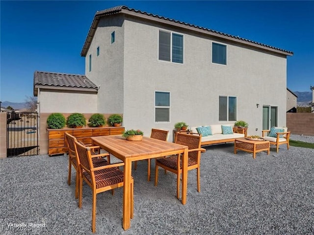 3981 E Teller Dr, Pahrump, NV 89061 - rear view of property featuring outdoor lounge area, stucco siding, a patio, a tiled roof, and outdoor dining area