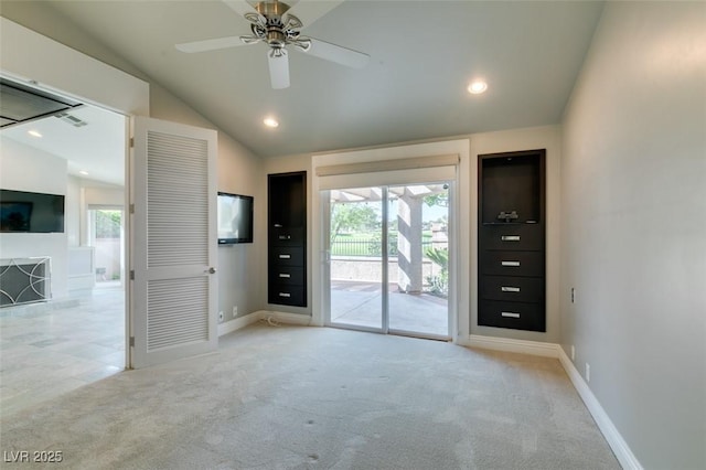 interior space featuring recessed lighting, a ceiling fan, visible vents, baseboards, and lofted ceiling
