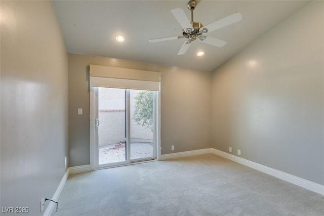 empty room with baseboards, a ceiling fan, and light carpet