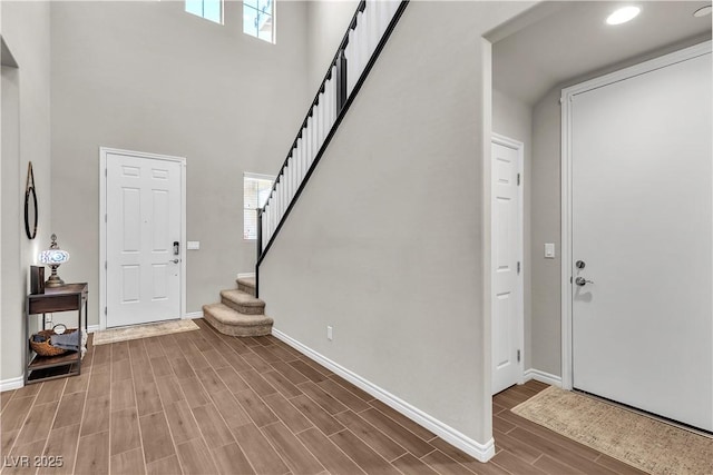 2833 Athena Hill Ct, Henderson, NV 89052 - entryway featuring wood finished floors, stairs, and a towering ceiling