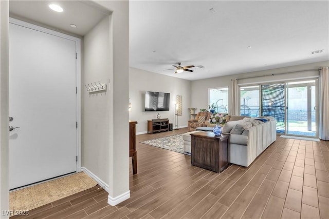 2833 Athena Hill Ct, Henderson, NV 89052 - living area featuring wood finished floors, plenty of natural light, a ceiling fan, and recessed lighting
