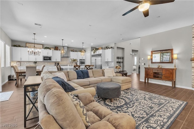 2833 Athena Hill Ct, Henderson, NV 89052 - living room featuring a ceiling fan, light wood-style floors, a chandelier, and recessed lighting