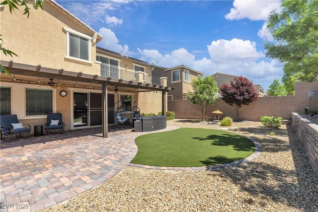 2833 Athena Hill Ct, Henderson, NV 89052 - fenced backyard featuring a ceiling fan, a balcony, and a patio area