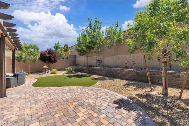 2833 Athena Hill Ct, Henderson, NV 89052 - fenced backyard featuring a patio area