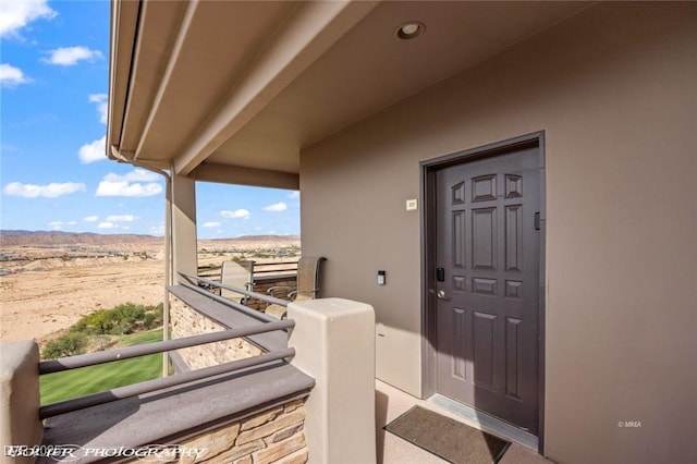 405 Paradise Pkwy Unit 170, Mesquite, NV 89027 - doorway to property featuring a mountain view and stucco siding