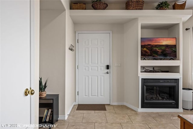 405 Paradise Pkwy Unit 170, Mesquite, NV 89027 - entrance foyer with a glass covered fireplace, light tile patterned floors, and baseboards
