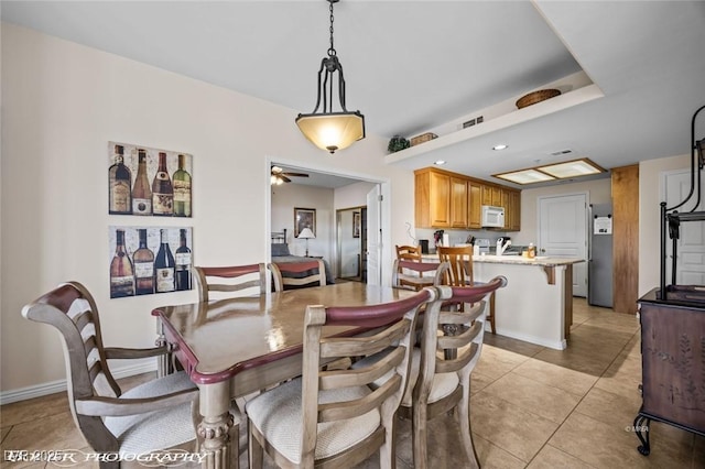 405 Paradise Pkwy Unit 170, Mesquite, NV 89027 - dining room with light tile patterned flooring, baseboards, and a ceiling fan