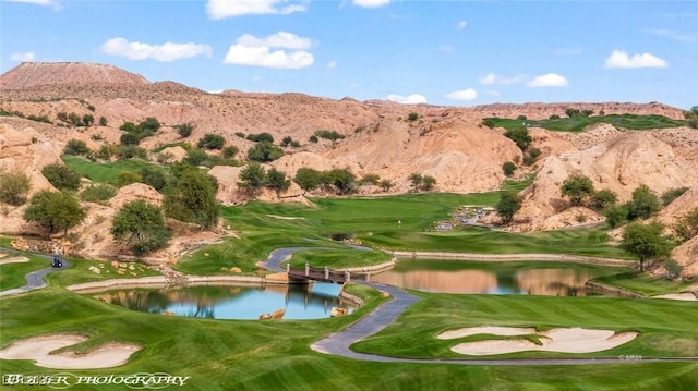 405 Paradise Pkwy Unit 170, Mesquite, NV 89027 - view of home's community with a water and mountain view, a lawn, and view of golf course