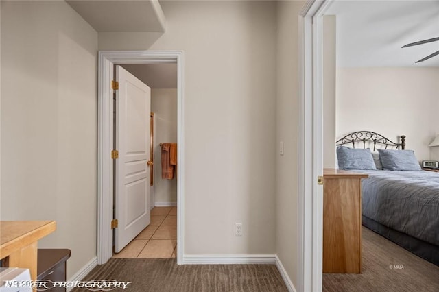 405 Paradise Pkwy Unit 170, Mesquite, NV 89027 - carpeted bedroom with tile patterned flooring and baseboards