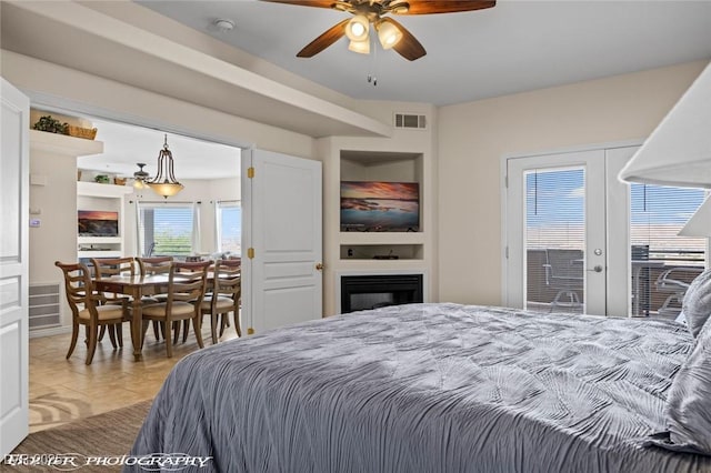 405 Paradise Pkwy Unit 170, Mesquite, NV 89027 - bedroom featuring visible vents, french doors, and a fireplace