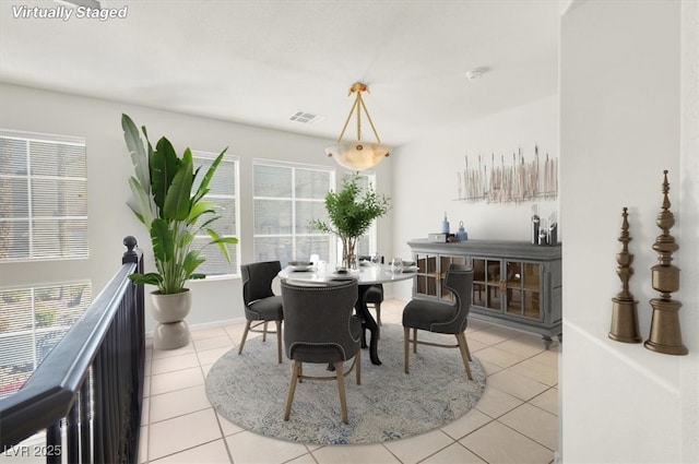 8426 Sluman Ct, Las Vegas, NV 89128 - dining room with light tile patterned floors and a heating unit