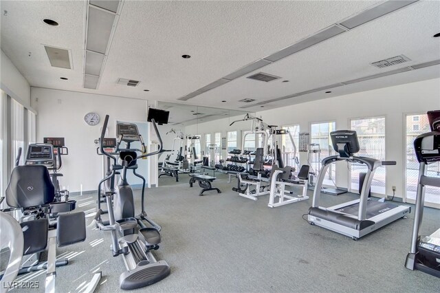 205 E Harmon Ave Unit 707, Las Vegas, NV 89169 - gym featuring a textured ceiling, visible vents, and plenty of natural light