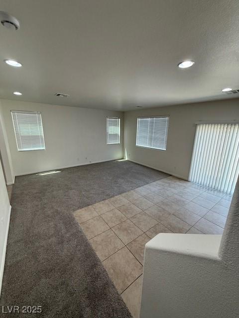 3104 Naggio Shores Ave, Las Vegas, NV 89141 - spare room with recessed lighting, light tile patterned floors, and light carpet