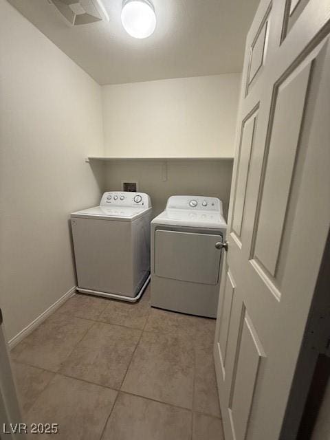 3104 Naggio Shores Ave, Las Vegas, NV 89141 - washroom with washing machine and clothes dryer and light tile patterned flooring