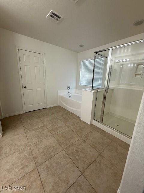 3104 Naggio Shores Ave, Las Vegas, NV 89141 - bathroom featuring tile patterned flooring, a bath, and a shower stall