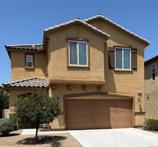 3104 Naggio Shores Ave, Las Vegas, NV 89141 - view of front of home featuring an attached garage, stucco siding, and a tiled roof