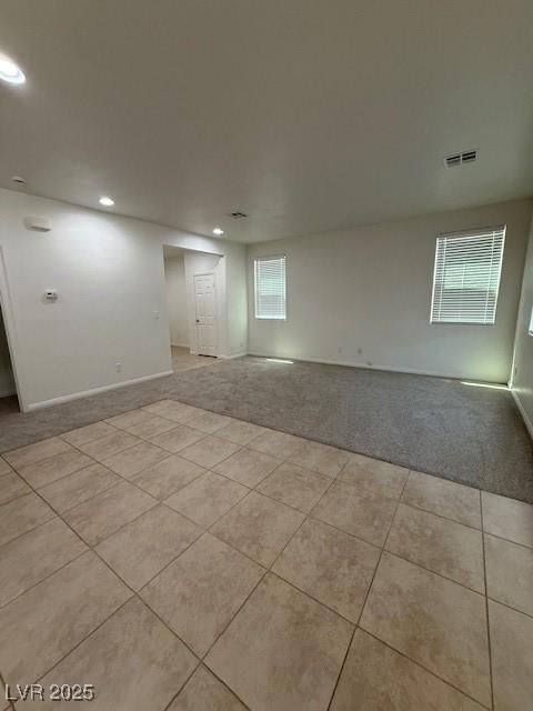 3104 Naggio Shores Ave, Las Vegas, NV 89141 - spare room with light carpet, healthy amount of natural light, recessed lighting, and light tile patterned flooring