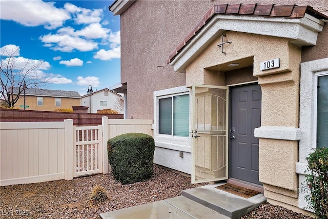 property entrance with fence
