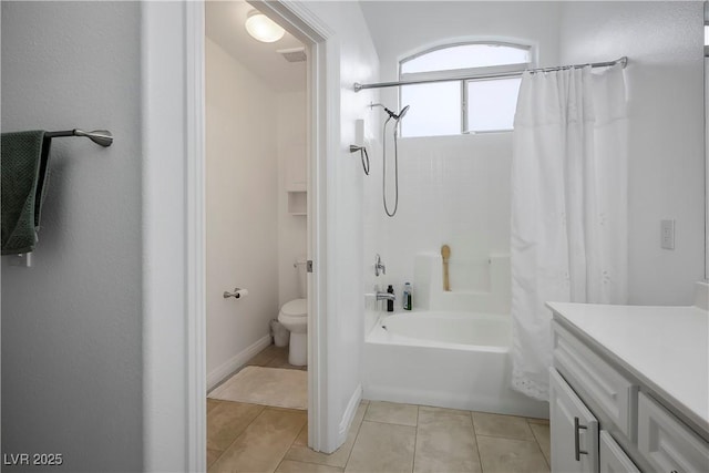 full bathroom featuring tile patterned flooring, visible vents, toilet, shower / tub combo with curtain, and vanity
