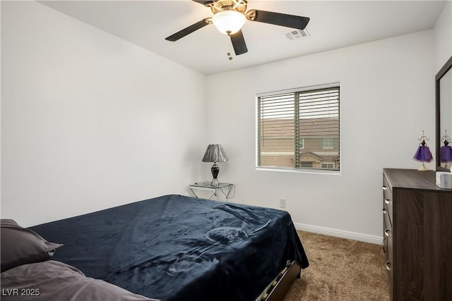 bedroom featuring visible vents, dark carpet, baseboards, and ceiling fan