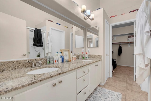 5000 Red Rock St Unit 241, Las Vegas, NV 89118 - full bathroom featuring double vanity, tile patterned flooring, and a spacious closet